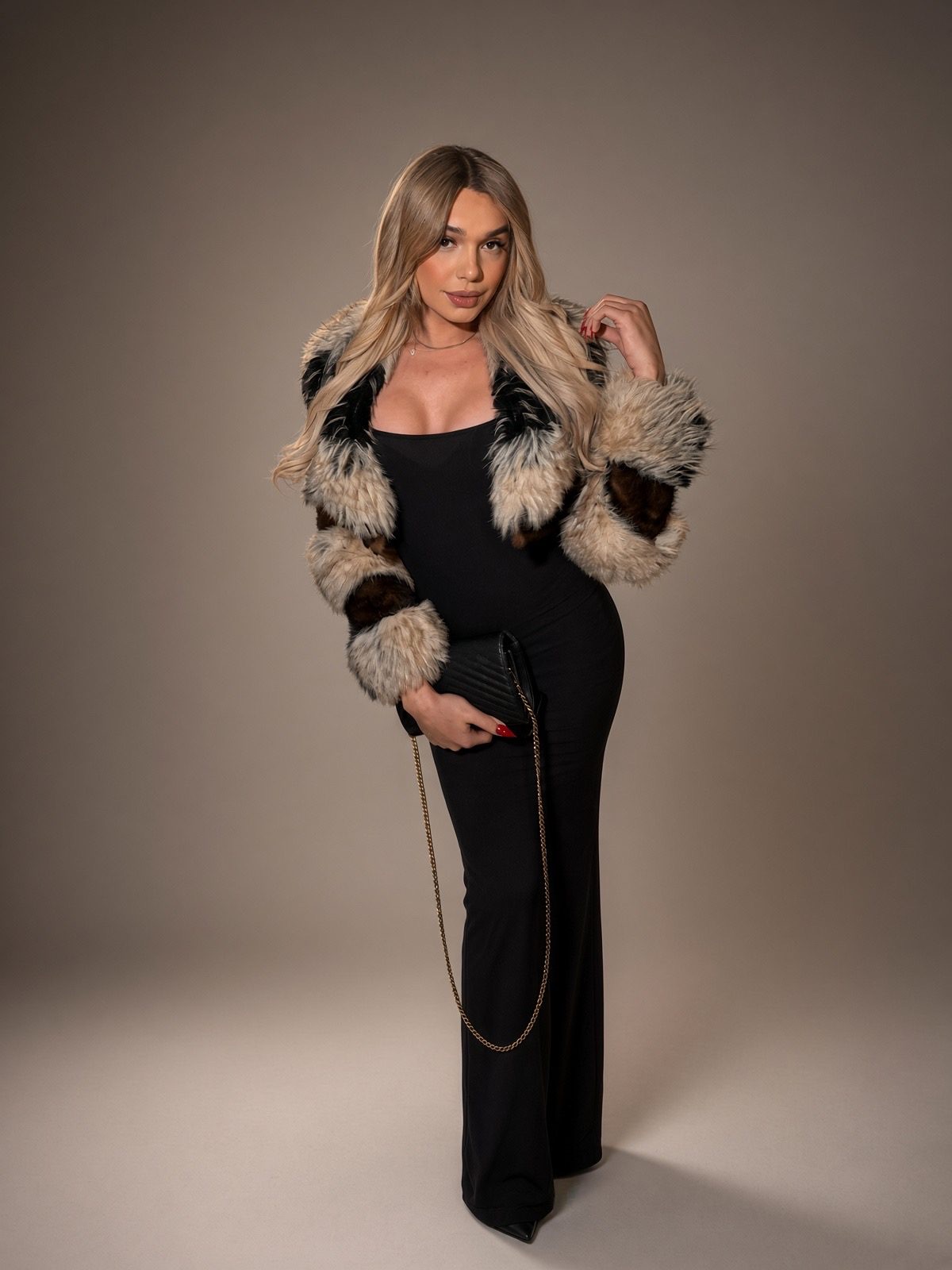 A long gown and fur, composed and unhurried.