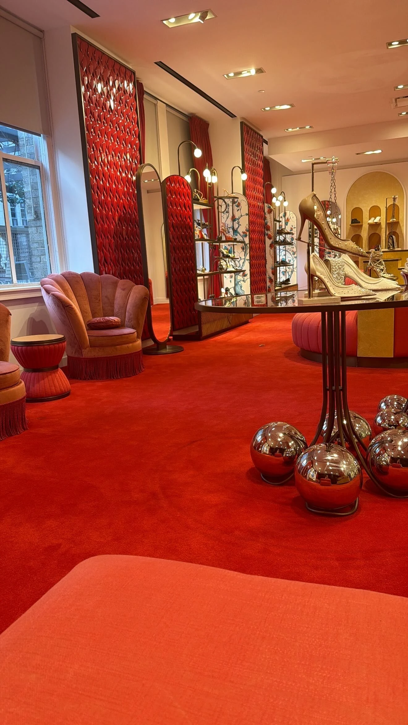 Crystal pumps and red velvet in a New York boutique.